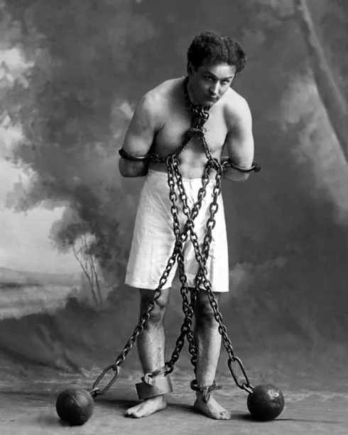 Houdini performing his handcuff escape